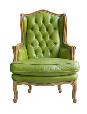 Elegant vintage wooden armchair with leather upholstery and pillowの写真素材