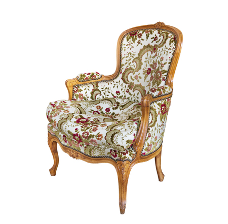 Antique armchair with upholstered fabric and wood trim. Isolated on white background.の写真素材