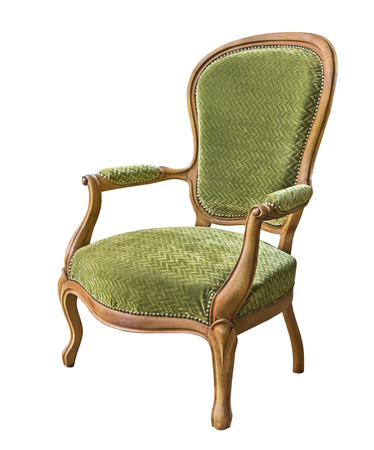 Vintage wooden armchair upholstered in green velvet isolated on white background. Retro style. Vintage furnitureの写真素材