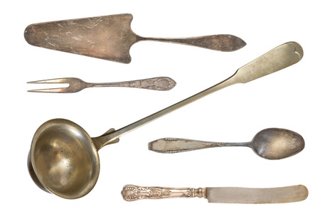 Vintage cutlery. Spatula for cake, fork, ladle, spoon and knife. isolated on white background. Antique silverware. Retro.の写真素材