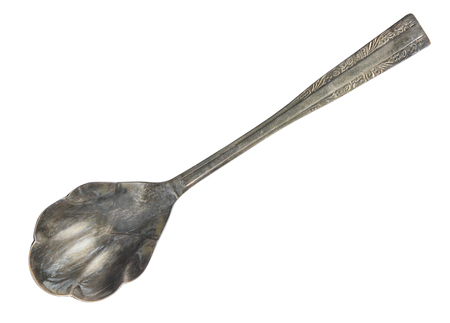 Top view of old silver beautiful tea spoon isolated on white backgroundの写真素材
