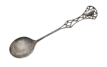 Top view of old silver beautiful tea spoon isolated on white backgroundの写真素材