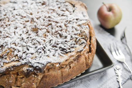 Apple pie, powdered sugar, apple and vintage forksの写真素材