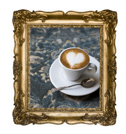 Vintage beautiful silver rectangular frame with an ornament, espresso macchiato coffee with foam heart isolated on white. Retro style.の写真素材