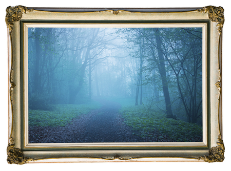 Picture in vintage frame. Mystical autumn forest with trail in blue fog. Beautiful landscape with...