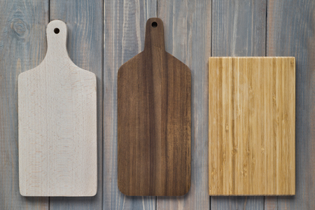Bamboo wood cutting board on a wooden gray backgroundの写真素材