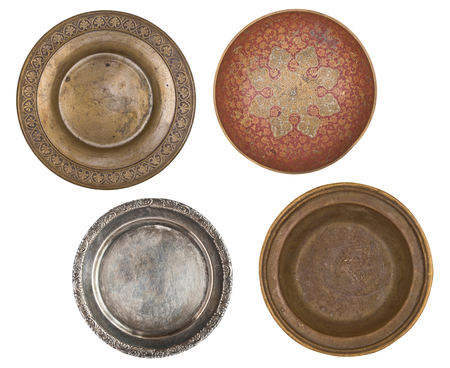 four antique metal painted plates isolated on white background. Retro style. Vintage.の写真素材