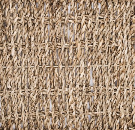 Texture of intertwined straw, basket, tree. Biodesign. Eco-friendly dishes.