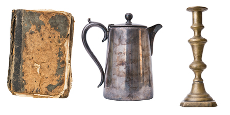 Set of 3 gorgeous old vintage items. Book, candlestic, teapot. Isolated on white background.の写真素材