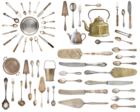 Vintage Silverware, antique spoons, forks, knives, ladle, cake shovels isolated on isolated white background. Antique silverware. Retro.の写真素材