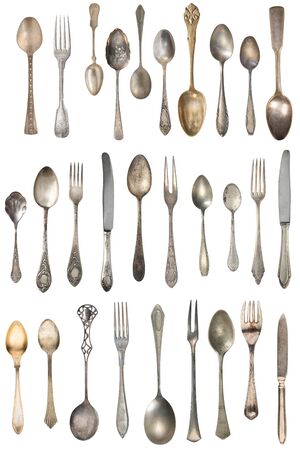 Vintage Silverware, antique spoons, forks, knives, ladle, cake shovels isolated on isolated white background. Antique silverware. Retro.の写真素材
