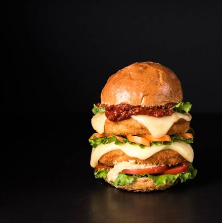 fresh tasty burger on a black background. Copy spaceの写真素材