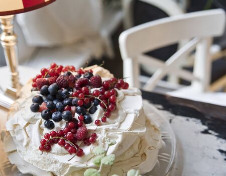 Cake meringues with berries. Delicious dessert. Copy space.の写真素材