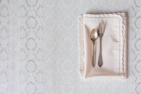 Table setting with fork and spoon on beautiful background. Copy space.の写真素材
