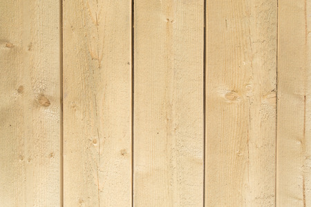 Raw wooden vertical panel plank wall backgroundの写真素材