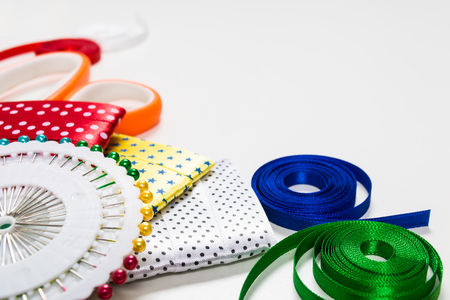 Scissors, pins and color tapes for sewing on white backgroundの写真素材
