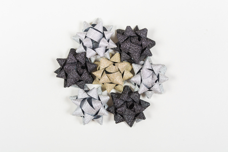 Silver, golden and black holiday man bows on white background with copy spaceの写真素材