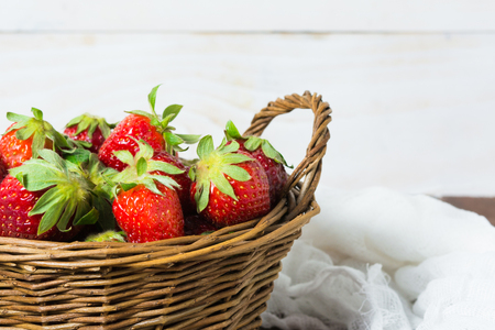Basket of strawberry with white backgroundの写真素材