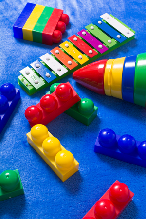 Kids colorful toys on the blue materialの写真素材