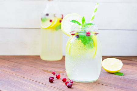 Homemade lemonade over brown wooden backgroundの写真素材