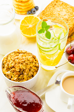 Granola for breakfast with detox water and coffee, healthy morning foodの写真素材