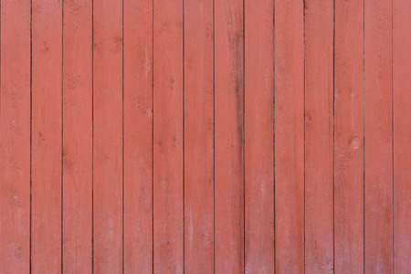 Red wooden vertical stripes texture wall backgroundの写真素材