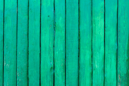 Green wooden vertical panel plank wall backgroundの写真素材