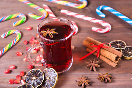 Hot pomegranate drink with anise and cinnamon and lollypopsの写真素材