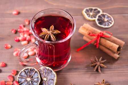 Hot pomegranate drink with anise, lemon and cinnamonの写真素材