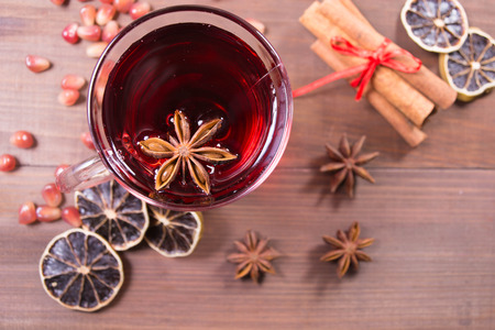 Hot pomegranate drink with anise and cinnamon, overhead viewの写真素材
