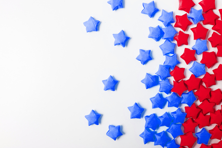 Two colored stars of paper on the white background with copy spaceの写真素材