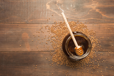 Healthy dark honey ove wooden table with copy spaceの写真素材