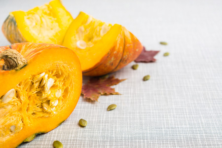 Fresh pumpkin over grey background with copy space, selective focusの写真素材