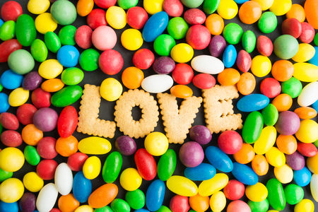 Concept of candies love, colorful candies with cookies, overhead viewの写真素材