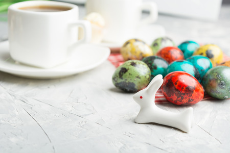 Easter morning with colorful eggs and hare in focusの写真素材