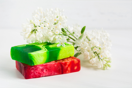 Colorful handmade soap with lilac aroma on white  backgroundの写真素材