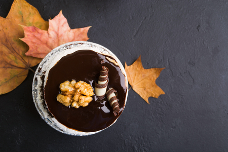 Sweet dessert with chocolate and nuts on black background with copy spaceの写真素材