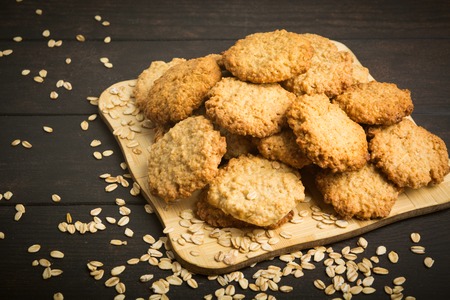 Many healthy oatmeal cookies on wooden background, selective focusの写真素材