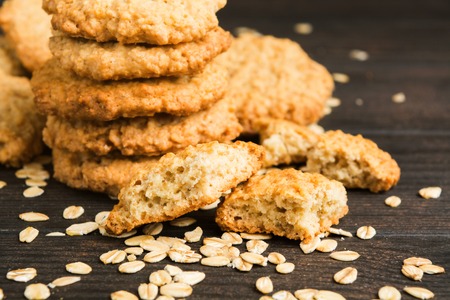 Cookies baked at home with oat on wooden backgroundの写真素材