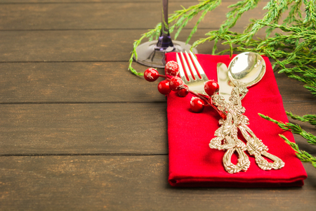 Winter holiday table setting on wooden table with copy spaceの写真素材