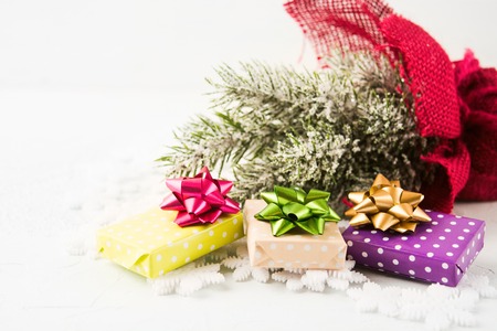 Christmas and New Year presents with fir treee decoration on white background with copy space