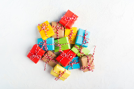 Stack of colorful gifts over white background with copy space, flat lay styleの写真素材