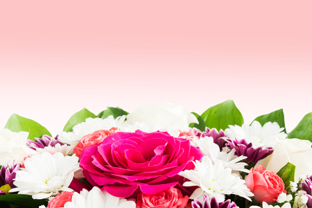 Bouquet of beautiful flowers with rose on pink background with copy spaceの写真素材