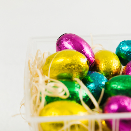 Chocolate candies in egg's form with copy space, selective focus, square shotの写真素材