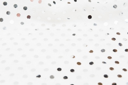 Glamour fabric textile material with silver metal sequins. Glitter shiny background. Selective focusの写真素材