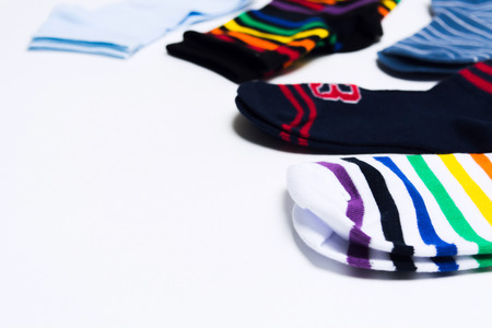 Colorful textile socks on white background for legs with copy space. Shopping concept for store....
