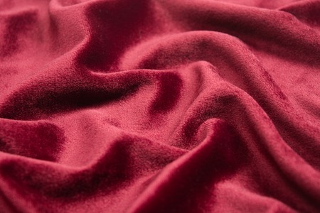 Red velvet texture with waves. Selective focusの写真素材