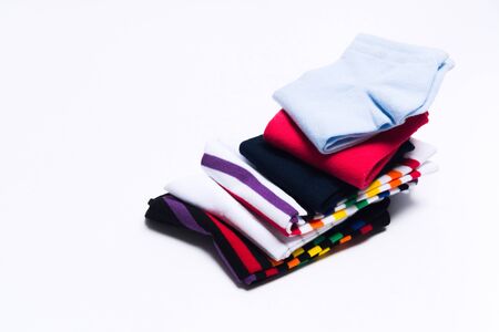 Different colorful socks in one stack for kids or woman. Fashion warm clothes for feet. Selective focusの写真素材