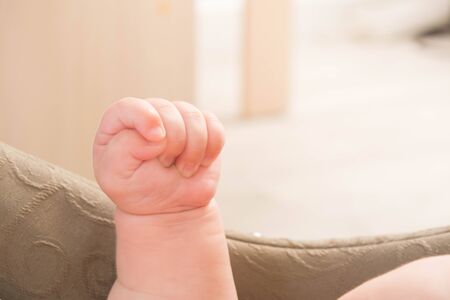 Baby hand in the air. Closeup view. Copy spaceの写真素材