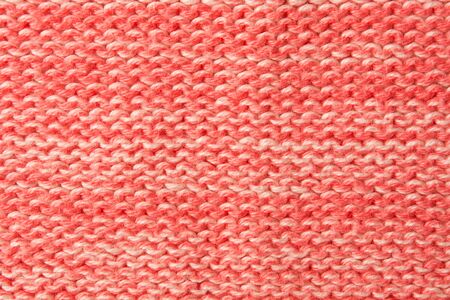 Closeup red woolen textured textile background. Soft warm clothes. Flat layの写真素材